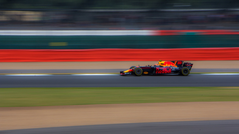 Formula one car driving on a track